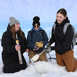 Students outside conducting a field lab