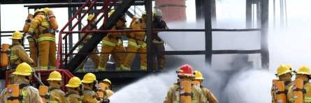 firefighters in live fire scenario