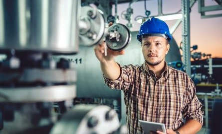 Gas Process Operator reading a gauge