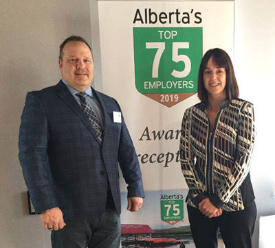 Dave King and Colleen Symes accept the award in Calgary