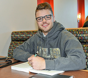 Tucker Cochrane in a Lloydminster study booth