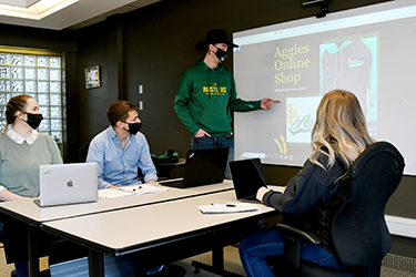 Lakeland College agricultural sciences students wearing face coverings during a presentation.