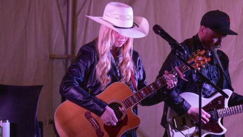 Abygale Durie strums her guitar