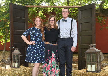 Emcees Quinn Hlus and Spencer Letts with Lakeland president Alice Wainwright-Stewart