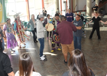 The Indigenous Student Committee with the powwow dancers.