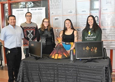Dr. Alice Wainwright-Stewart, president and CEO, visits the Indigenous cultural display hosted by the committee