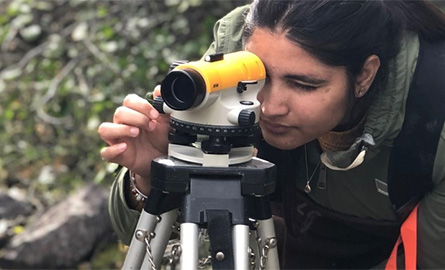 Student surveying land