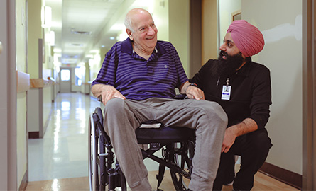 Health care aide student and elderly man