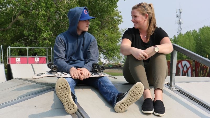 CYC student talks with a youth