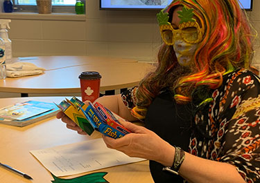 Joanne McDonald, chair of human services and course instructor, participates in Lana Rogan's presentation.