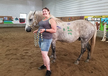 Kelsie McCabe and animal assisted wellness horse