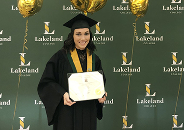 Courtney Linch holds her diploma following the graduation at the Lloydminster campus.