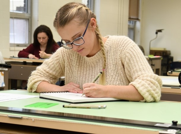 Interior design student drafting plans