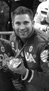 John Morris holding gold medal