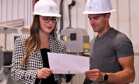 Katie reviewing a plan with a coworker