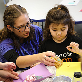 Lakeland student playing games with students in a classroom