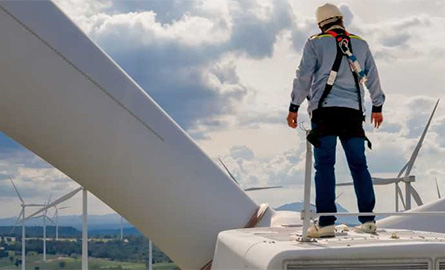 Man on top of a wind turbine