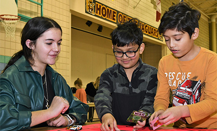 grade 3 students try a Math Fair game