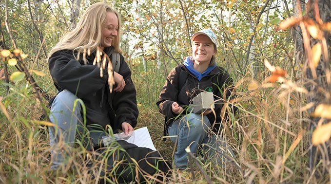 Environmental science students participating in outdoor labs