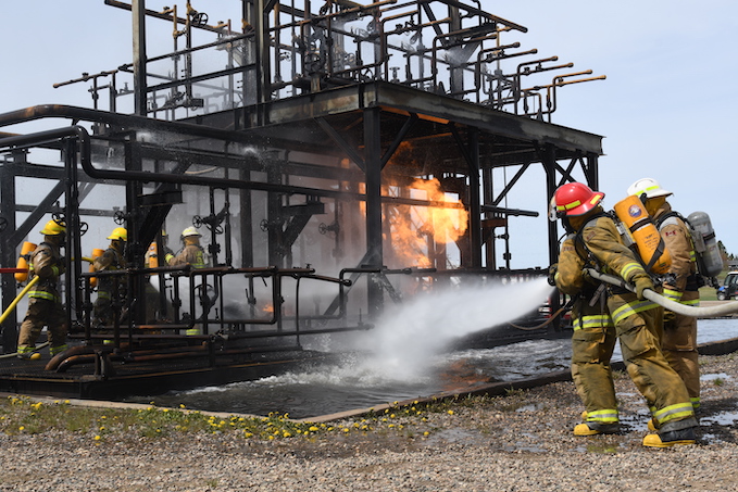 Firefighter students battle a training blaze