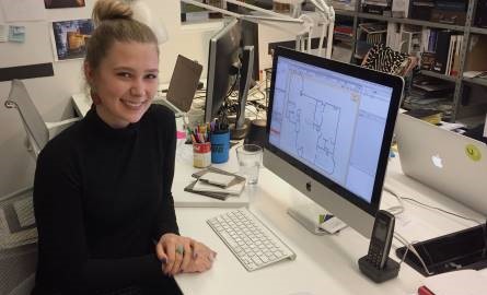 interior design student at desk during practicum