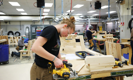 Student using a circular saw