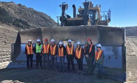 students inside a piece of mining equipment