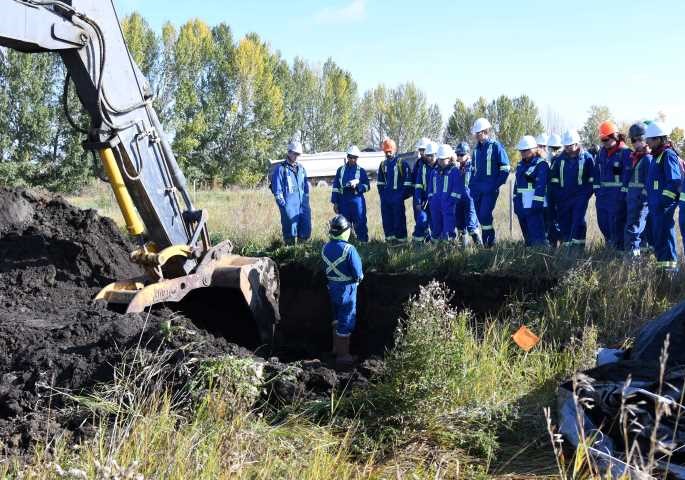 students at a dig site