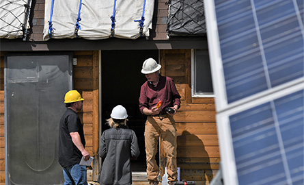 Students learning how to install solar panels