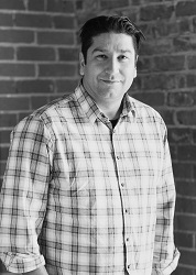 Black and white photo of Dr. Sean Lessard