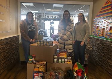 he group delivering the items and funds they raised to the Be Brave Ranch.