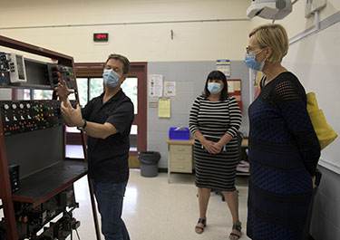 Greg Barr (left) demonstrates an electric lab board to Lakeland's Eileen Arthur and the BTPS superintendent Rhae-Ann Holoien.