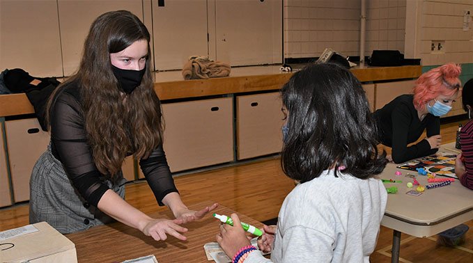 Allecia McDonald using her breakbox game at the Math Fair.