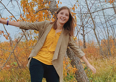 Tia Pavo outside on a fall day