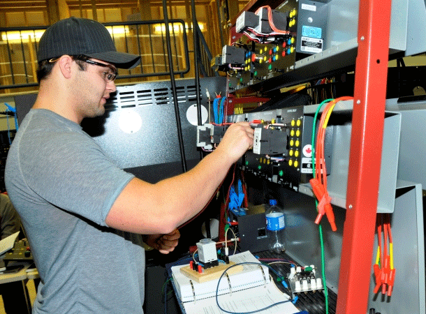 Student plugging in a wire