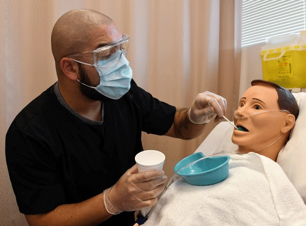 Student practicing skills on equipment