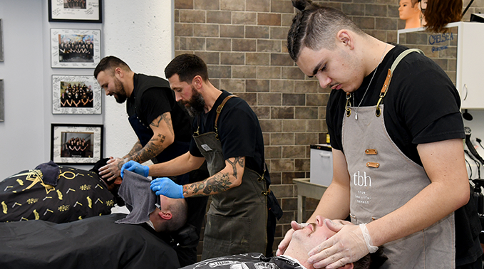 Student barbers practicing in the Lakeland salon