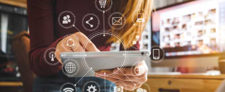 laptop open with marketing tool icons spilling out