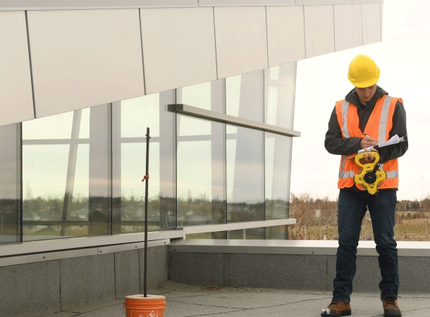 Real estate appraiser working at a construction site